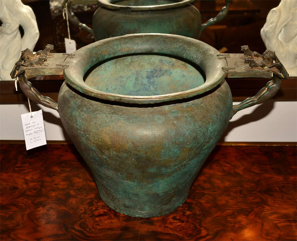 a bronze vase in the antique taste sporting two handles with an unusual design of "man and lions". Copy of original Roman vase displayed in Naples Museum