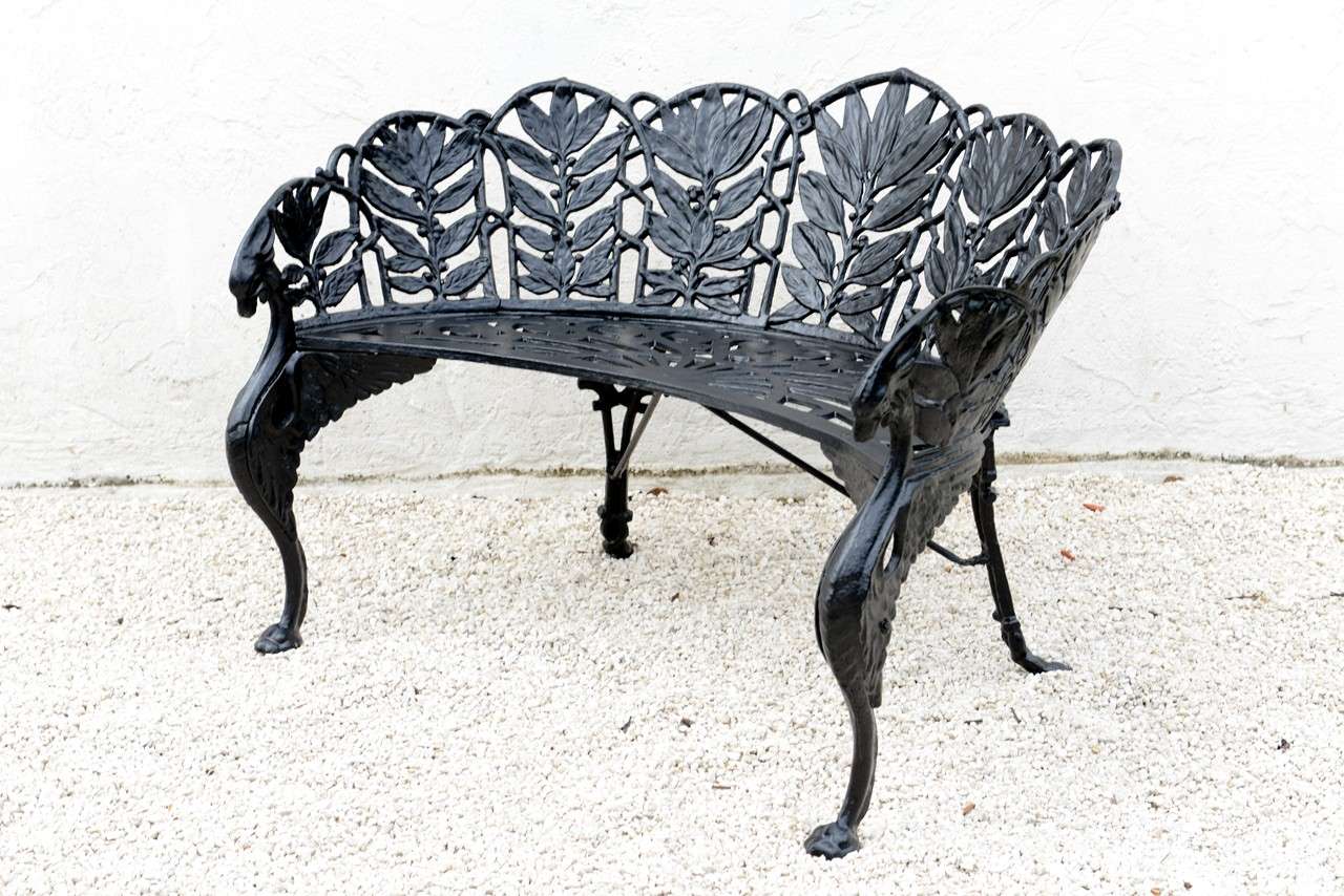 Unique pair of early twentieth century cast iron garden benches.  Back panels of laurel leaves, open scroll patterned seats and winged griffin front legs. Reduced from $3,600.00.

Please feel free to contact us directly for a shipping quote or any