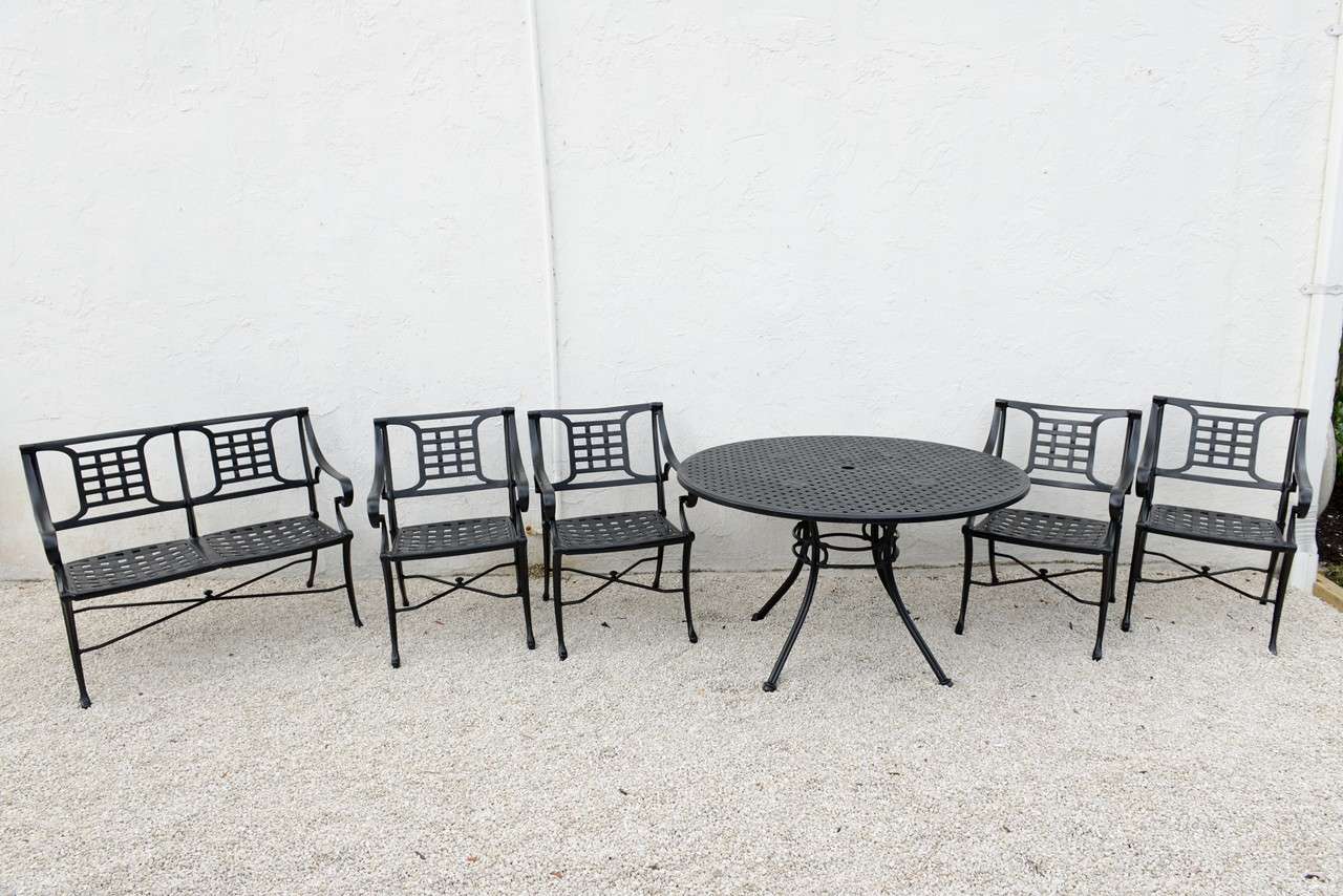 Mid-Century cast aluminum, eight-piece garden set. Set consists of four armchairs (18.5