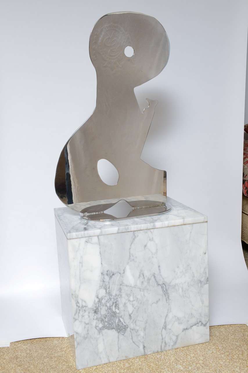 Abstract polished metal sculpture on by American artist Jack Schuyler. 

Signed and dated (1997). Sculpture measures 30.5 in. high x 19 in. length x 9 in. deep. 

The sculpture can be purchased separately from the base and the base separate from the