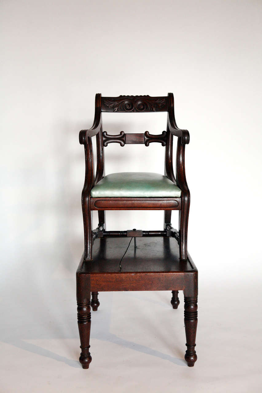 Period English Regency mahogany high chair with a table form base and detachable chair with 20th century leather seat.