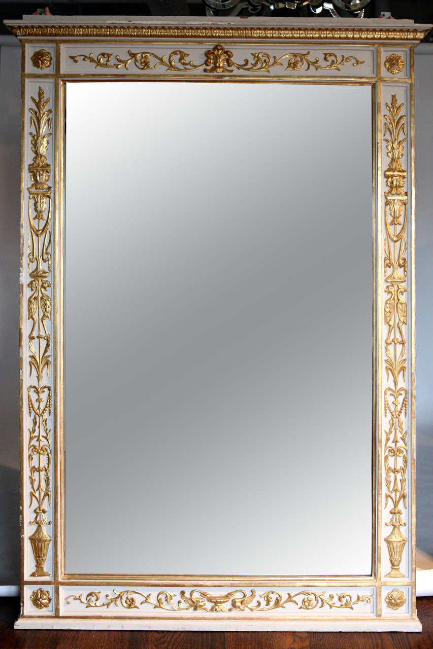 Pair of 19th century Directoire style mirrors. Painted with water gilt decoration.  Replaced mirrors.