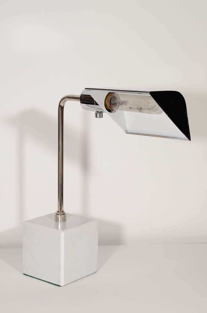 Pair of Mid Century Modern desk lamps in chrome with polished Carrera marble cubed bases. Designed with adjustable/rotating triangular shades and fitted with dimmer switch. In excellent condition and sold separately for $1,600 ea.