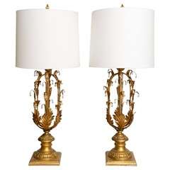 A pair of Italian Gilded Wood Lamps with Crystal Drops