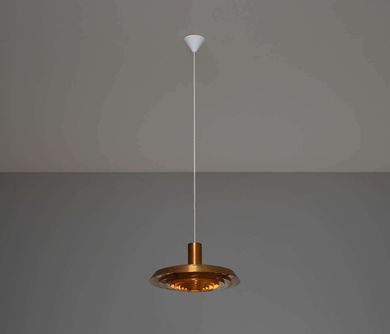 Plate pendant, in copper, by Poul Henningsen for Louis Poulsen, Denmark, 1950s.

A beautiful 