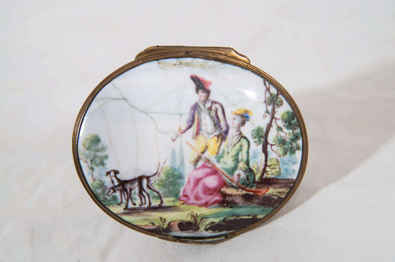 Small enamel boxes are often said to be the most appealing and delightful products from Georgian craftsmen. The boxes were made to carry snuff or beauty patches and were often given as tokens of affection.
This box is molded with the figure of a