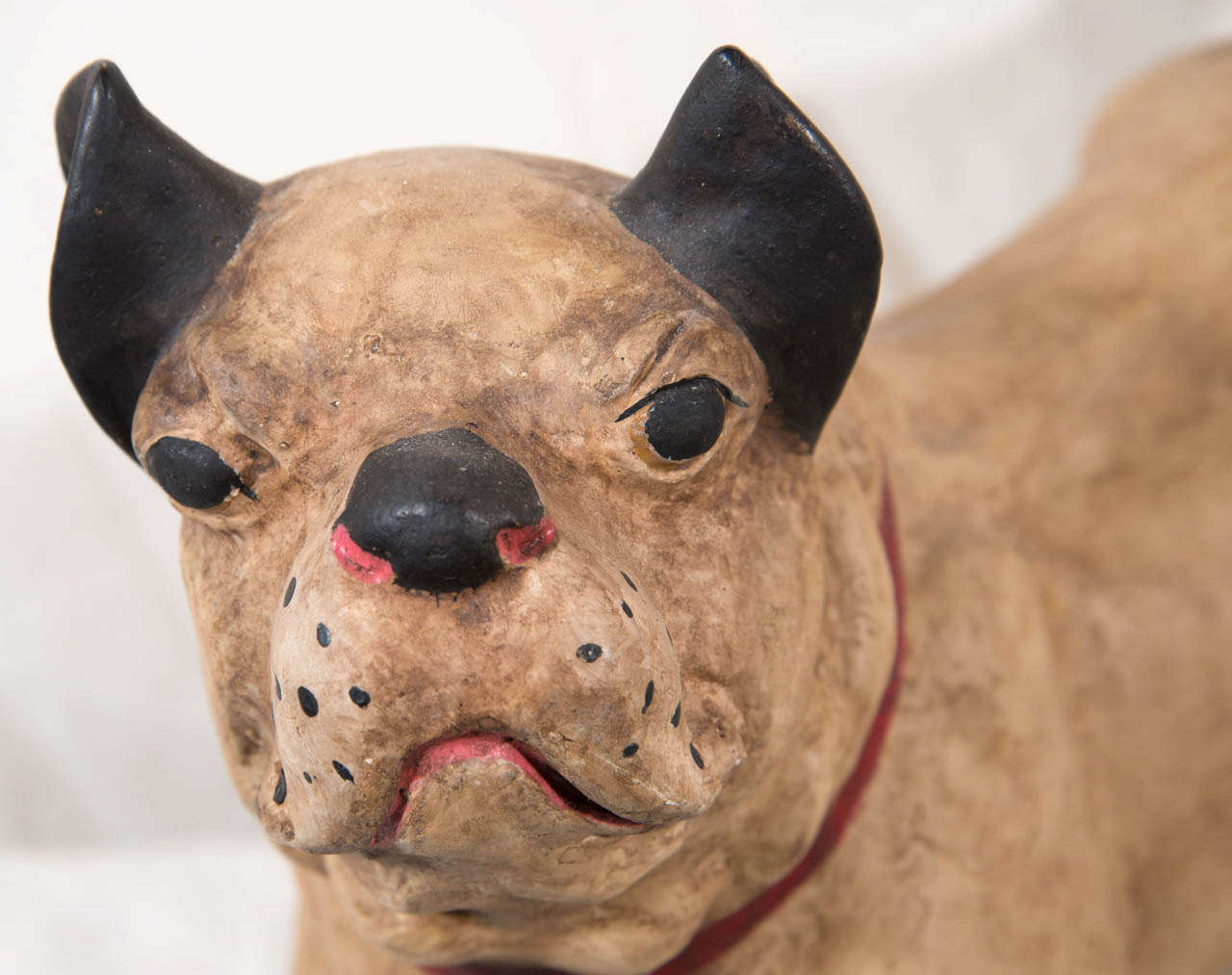 A funny little paper mache figure of a french bulldog with head upturned. Completely hand made with wonderful aging. His surface is hand painted in light and medium brown, his ears, eyes, and snout painted black, his collar and mouth painted red. He