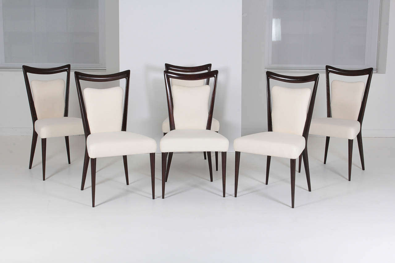 Walnut stained maple side chairs with muslin covered seat and back. These are from the resort hotel in Merano Italy, the Grand Bristol. Designed by Melchiorre Bega and Mario Gottardi. Last set available.