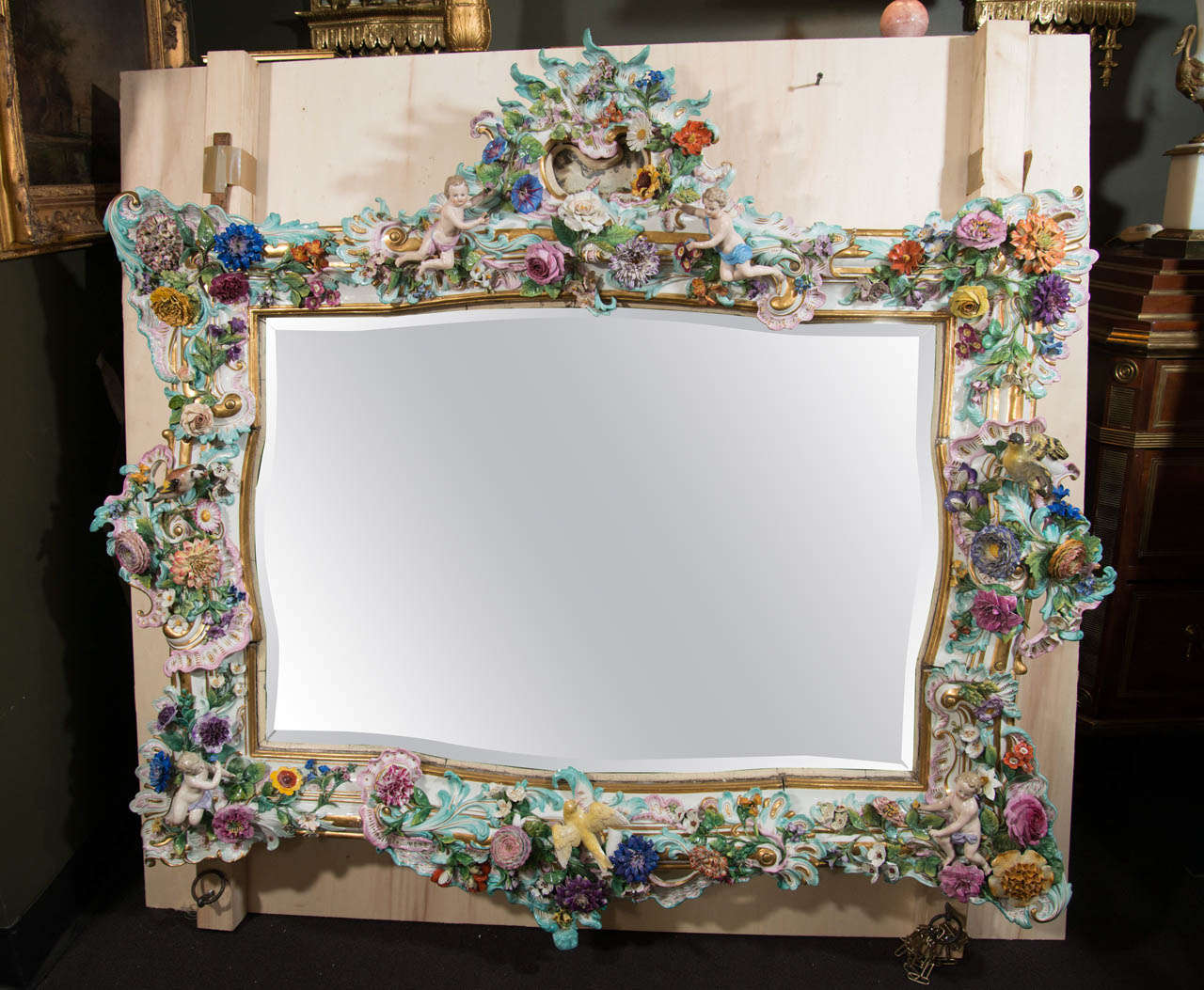 A Highly Important & Palatial Antique German Meissen Figural gilded , polychromed enameled Porcelain of exceptional craftsmanship and unusual shape. This unique mirror is embellished with figures, birds & adorned with over one thousand hand made