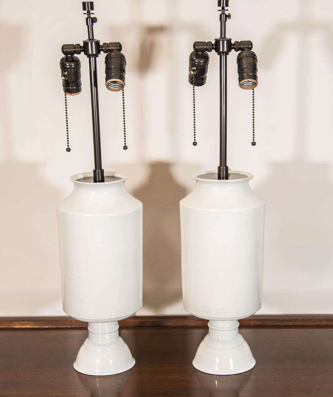 Pair of unusually shaped Korean white porcelain vessels fitted as lamps.