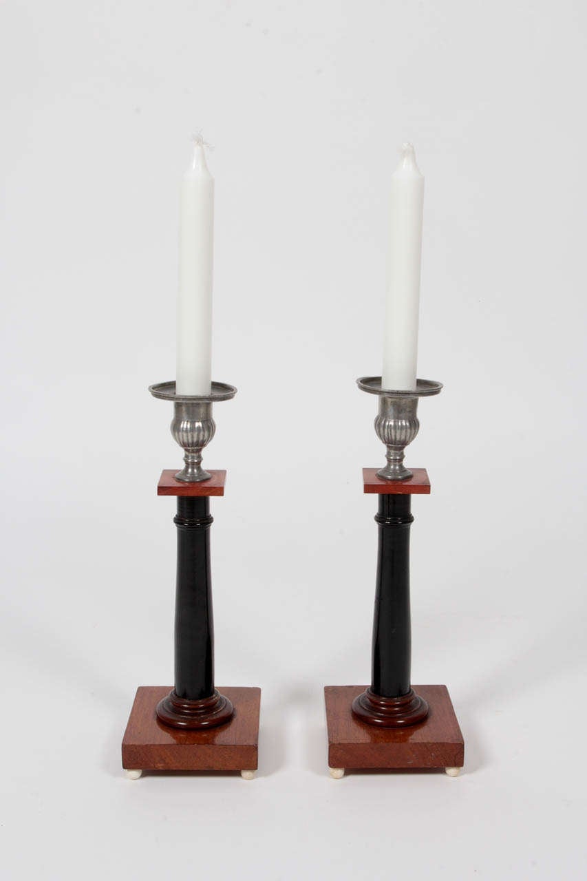 A good pair of Swedish Empire pewter, mahogany and ebonized candlesticks with bone ball feet, Circa 1810-20