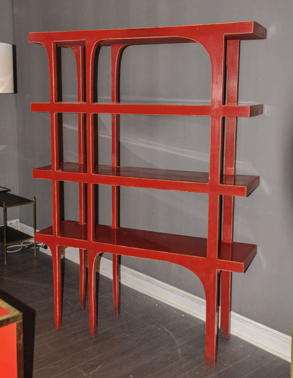 1970's bookshelves in red lacquered wood. Some scratches and wear traces on the lacquer. Good condition. Normal wear consistent with age and use.