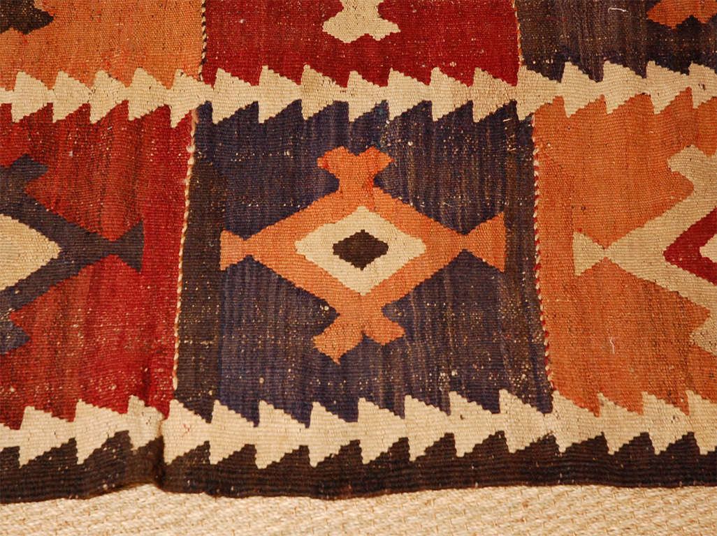 Great turn of last century flatweave wool carpet. Unusual soft colors and bold graphic design. Carpet recently cleaned.<br />
<br />
SALE: Originally Priced at $2187