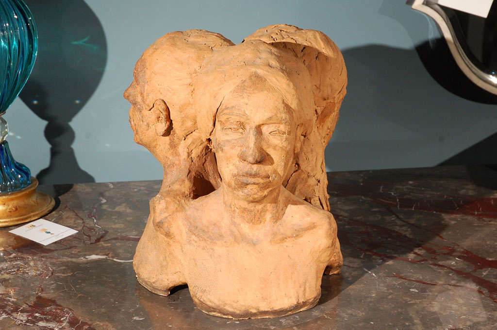 1971 terracotta sculpture of three ladies' heads by Maynard.