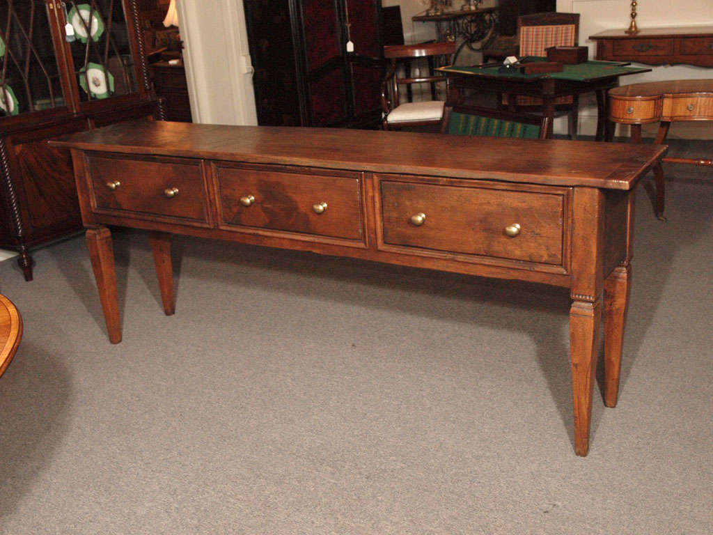 Antique French provincial 3-drawer oak server with brass knobs.