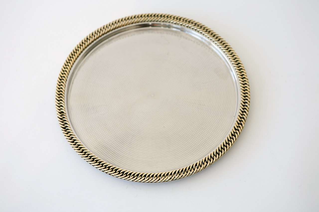 A stunning Hermes tray in nickel plate with a precision engraved pattern decorating the tray's surface and a brass chain edge detail. Stamped on the underside 