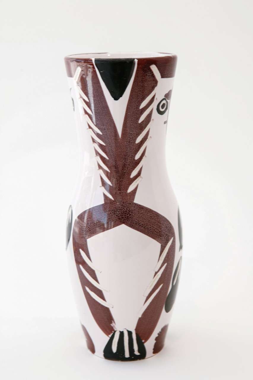 One of an edition of 500 produced, this vase of a young wood owl is made from white earthenware clay and decorated in black and brown oxides knife-engraved on white enamel. Inscribed 'Edition Picasso' and 'Madoura' and with the 'Edition Picasso'