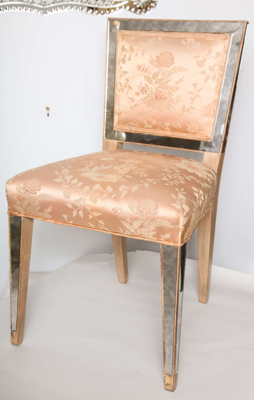 A fabulous unique Art Deco eglomise mirrored twin vanity with matching silk upholstered chairs and waste basket.
