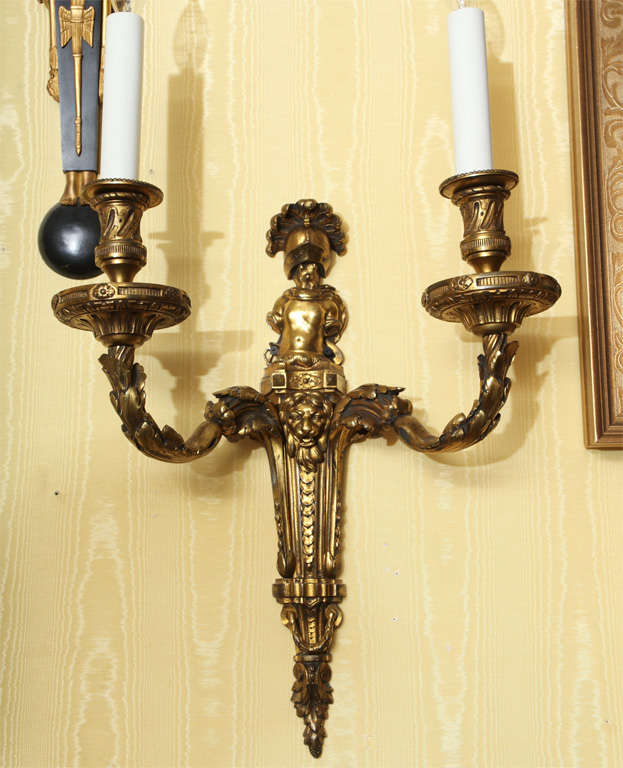 Set of four very fine quality and unusual Louis XVI style French bronze doré sconces, with armor motif.
Stock Number: LS11.