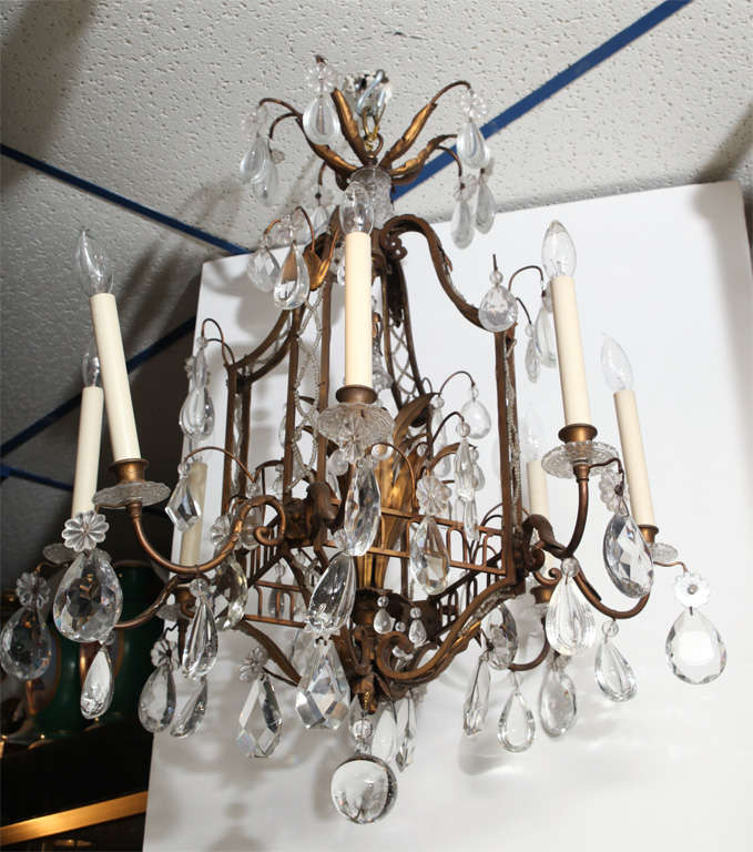 A Fine Cage Form Eight-Light Crystal and Bronze Chandelier
Stock Number: L409