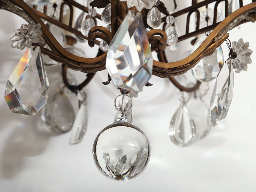 A Fine Cage Form Eight-Light Crystal and Bronze Chandelier In Good Condition In New York, NY
