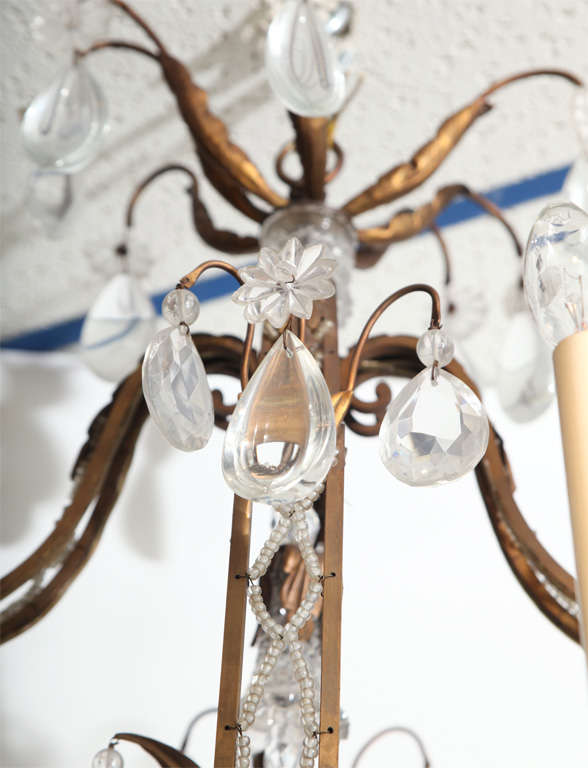 A Fine Cage Form Eight-Light Crystal and Bronze Chandelier 1