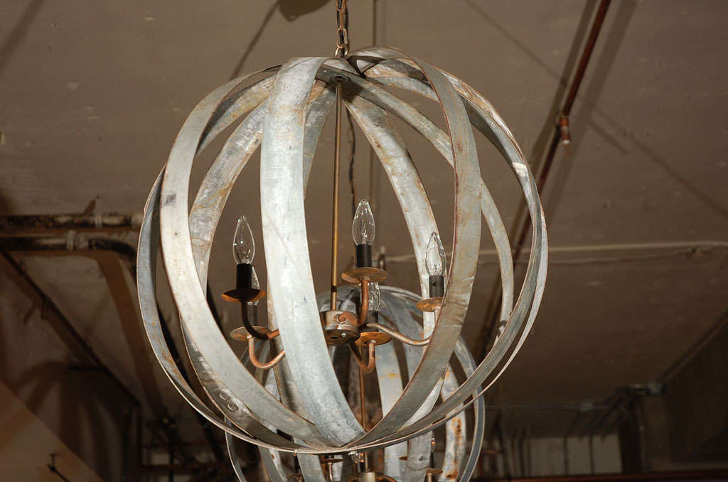 Elegant, industrial chandelier made from repurposed vintage wine barrel ties.