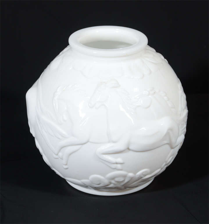 This stunning vase features leaping stylized deco horses with a stylized geometric floral and cloud motif.