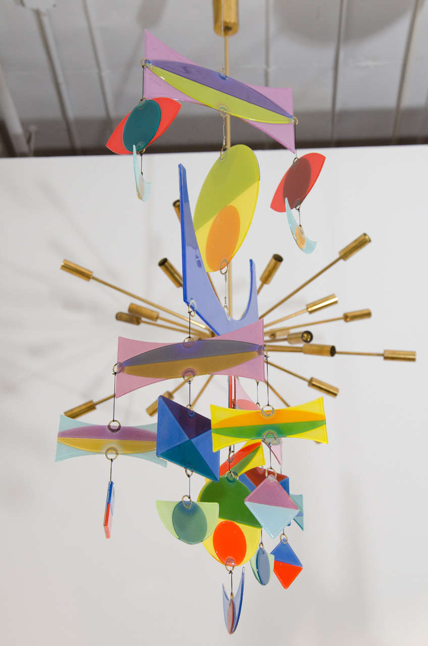 Art glass mobile by Higgins Glass. Vibrant colors and signature shapes make this mobile a charming addition for any mid-century or modernist collector.