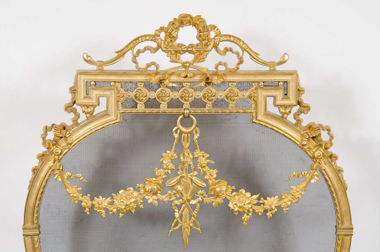Exquisite French Dore Bronze Fire Screen With Garland and Greek key detailing In Excellent Condition In New York, NY