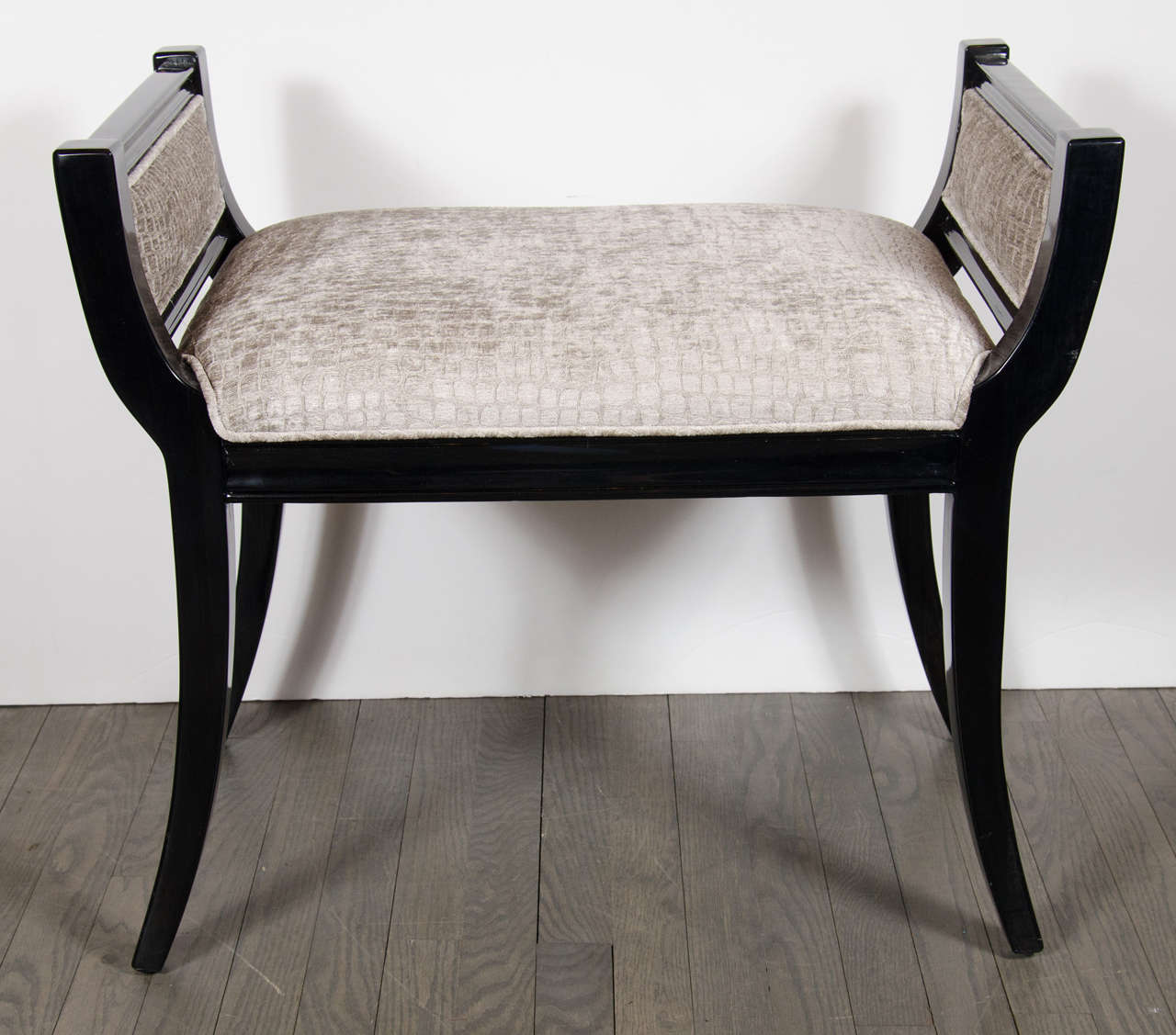 This stunning Mid-Century Modernist scroll form bench features ebonized walnut and gauffraged smoked topaz crocodile velvet. It's ultra chic design and simplicity would look beautiful in any room. It has been newly upholstered and mint restored.