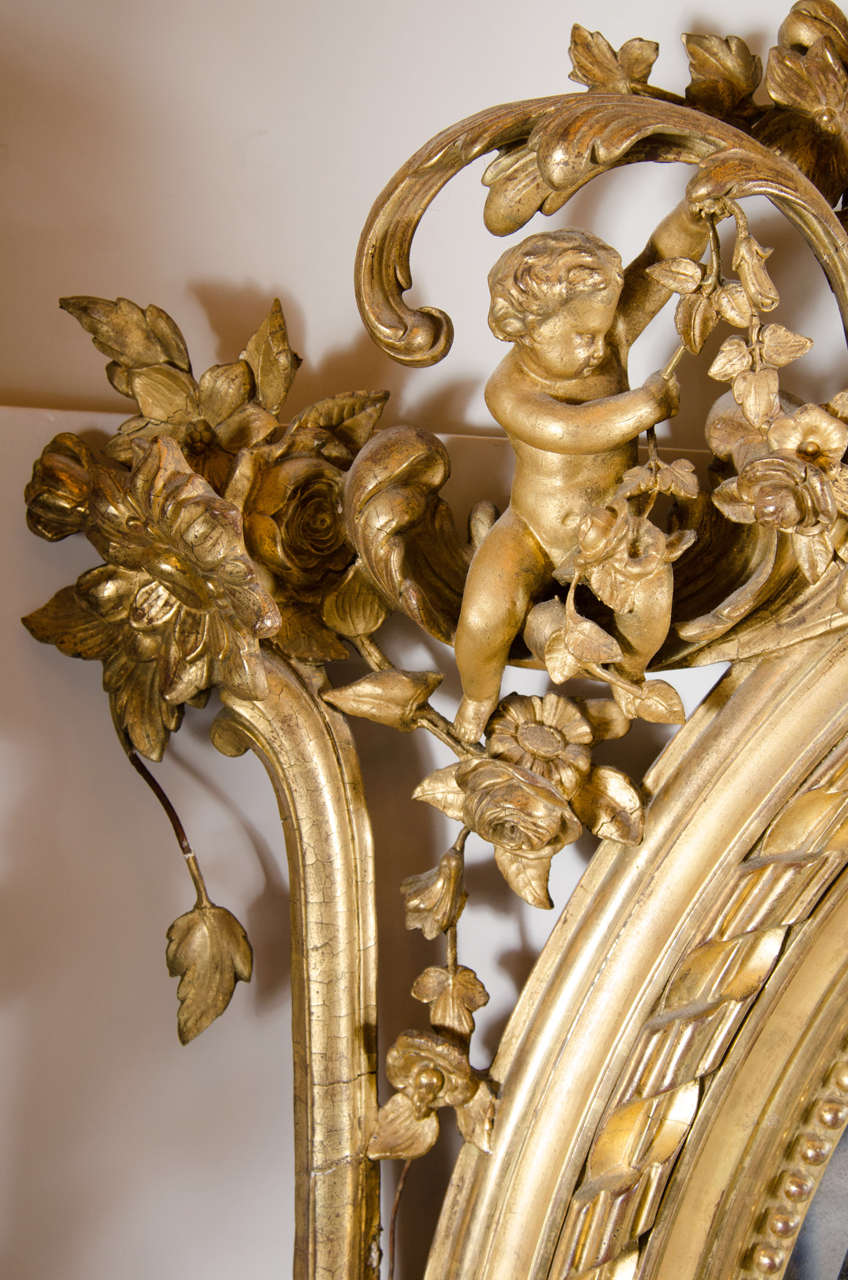 19th Century French Rococo Oval Mirror with 24-Karat Gold Gilt and Foliage Details