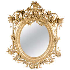 French Rococo Oval Mirror with 24-Karat Gold Gilt and Foliage Details