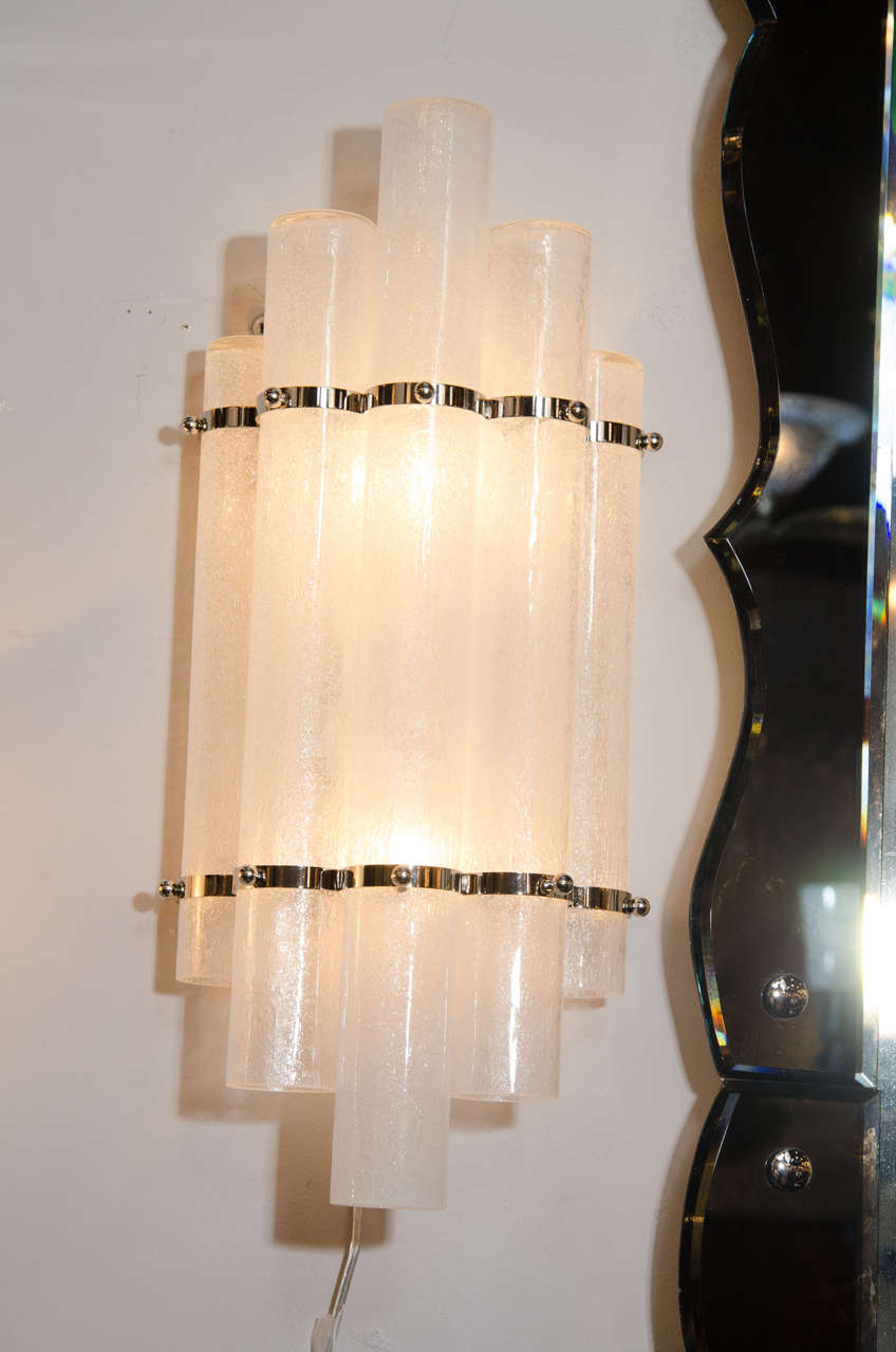 This stunning pair of Mid-Century Modern sconces were realized in Murano, Italy-
the islands off the coast of Venice that have been renowned for centuries for their superlative glass production. Realized in the manner of Pulegoso, they feature five