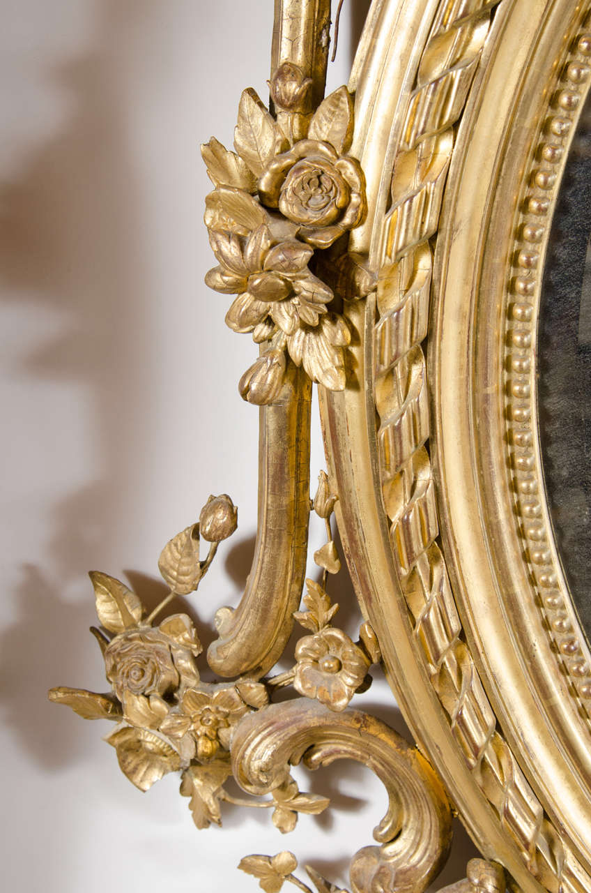 French Rococo Oval Mirror with 24Karat Gold Gilt and Foliage Details at 1stdibs
