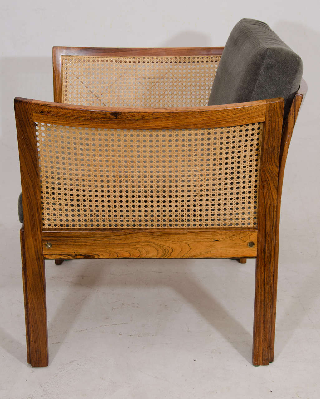 Pair of Rosewood and Cane Lounge Chairs by Illum Wikkelso In Good Condition In New York, NY