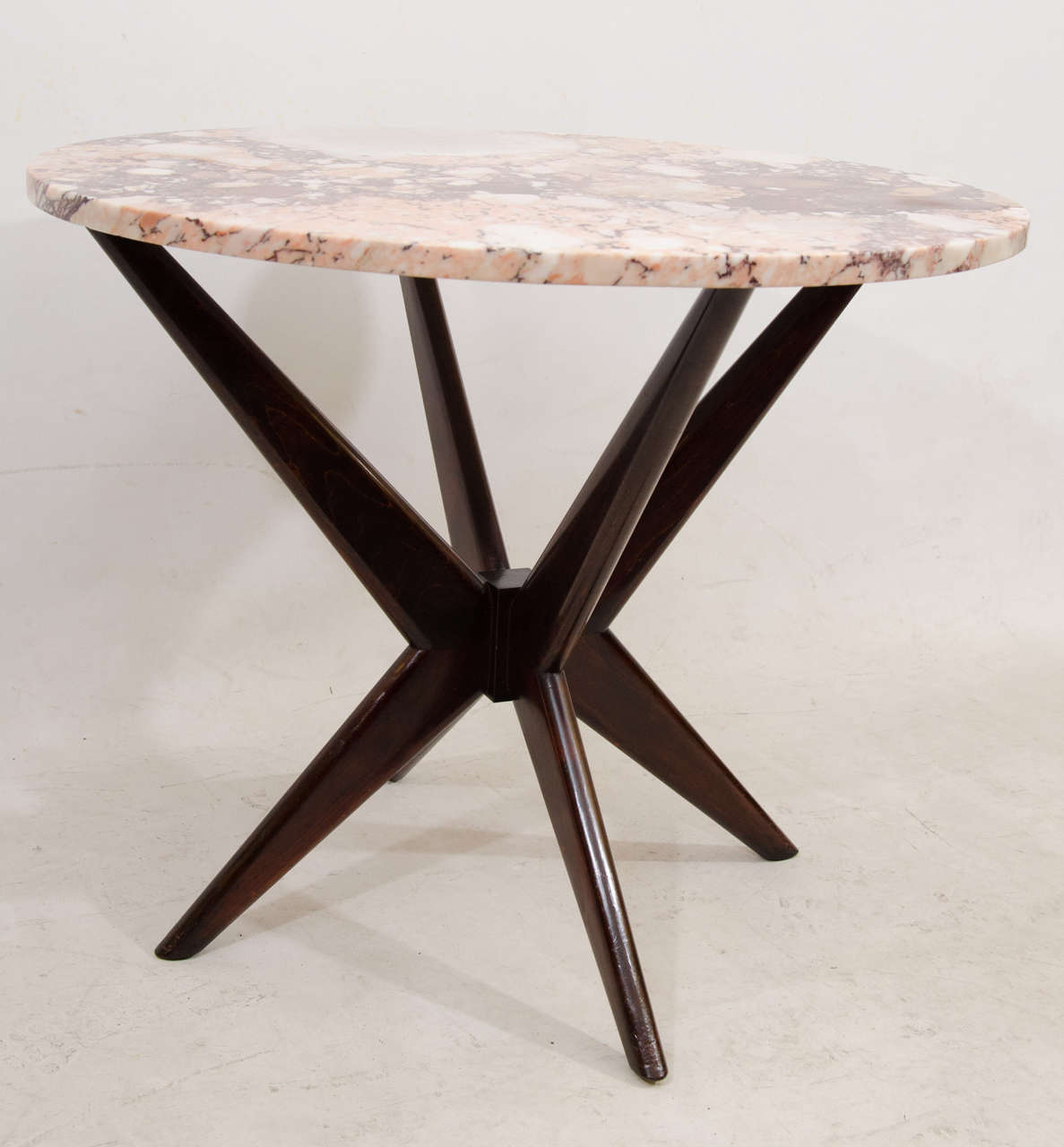 Handsome, small and versatile marble topped table. This piece can be used for a petite dining table or occasional table. Please contact for location. 