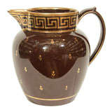 A Wilson Brown Jug with a Greek key Border