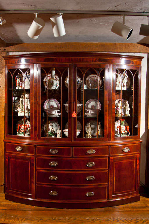 Just the right amount of arc makes this custom, English-made mahogany* cabinet pleasing to the eye while optimizing storage and display in a piece that is only 22