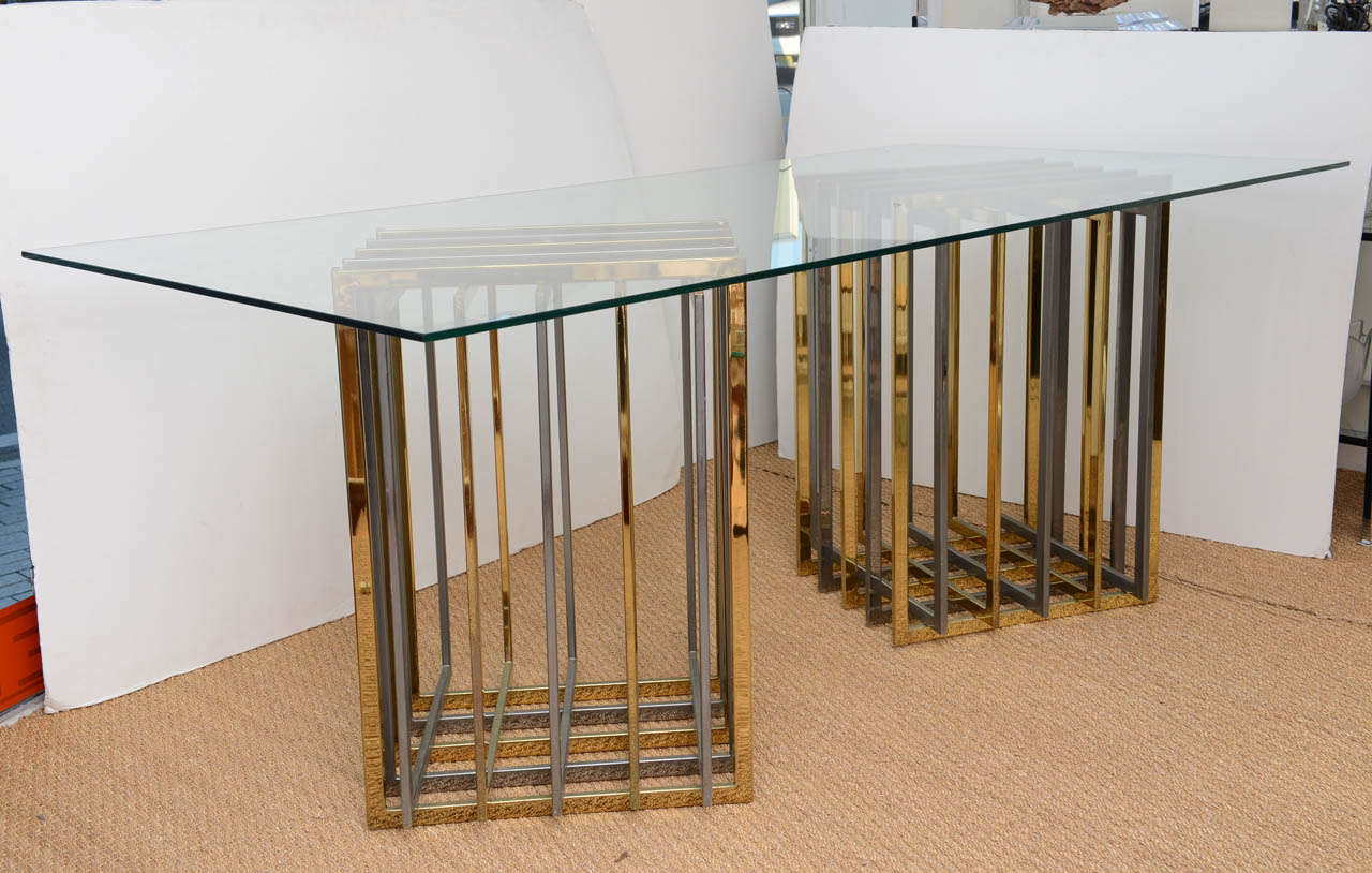 Brass and chrome table bases in a cage form.