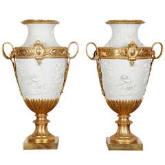 Pair of Louis XVI Style Biscuit and Bronze Vases