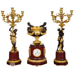 Gorgeous mantel clock with candelabras signed Delafontaine.