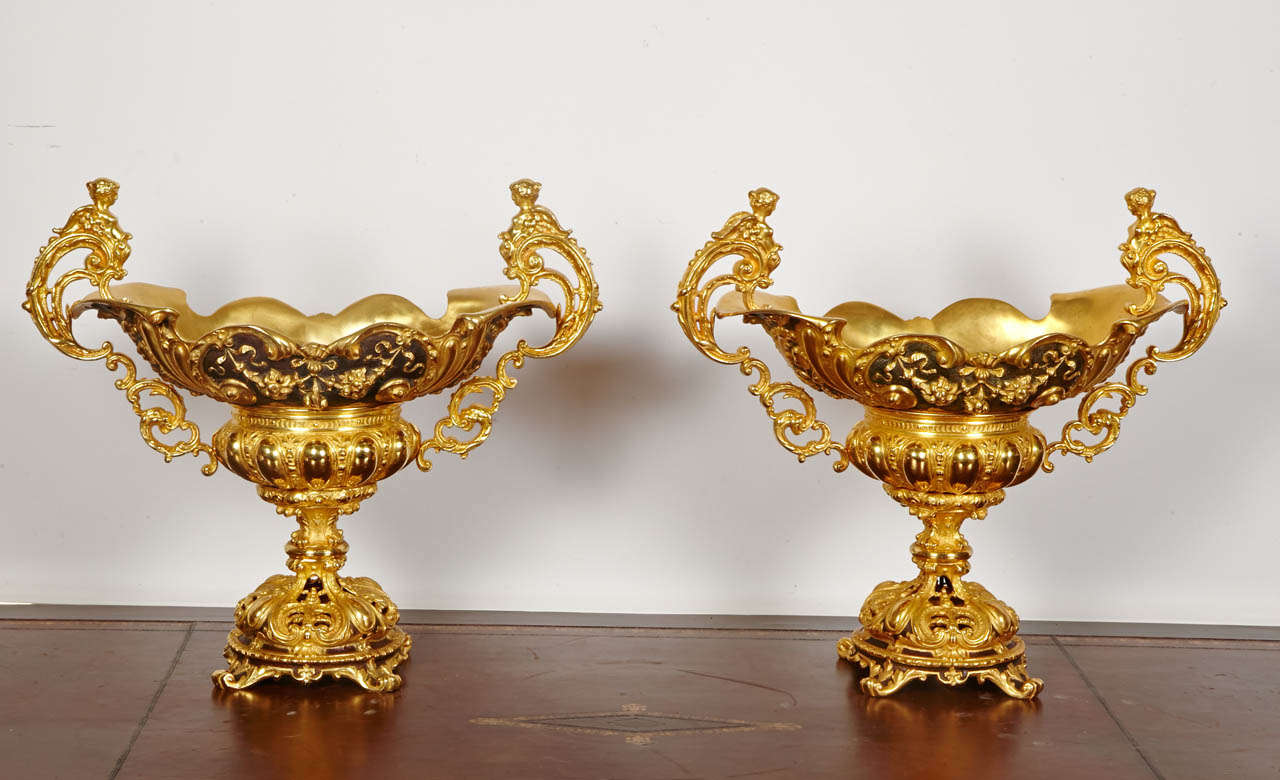 Pair of gilded and brown patina bronze cups 
very well carved and chiseled.