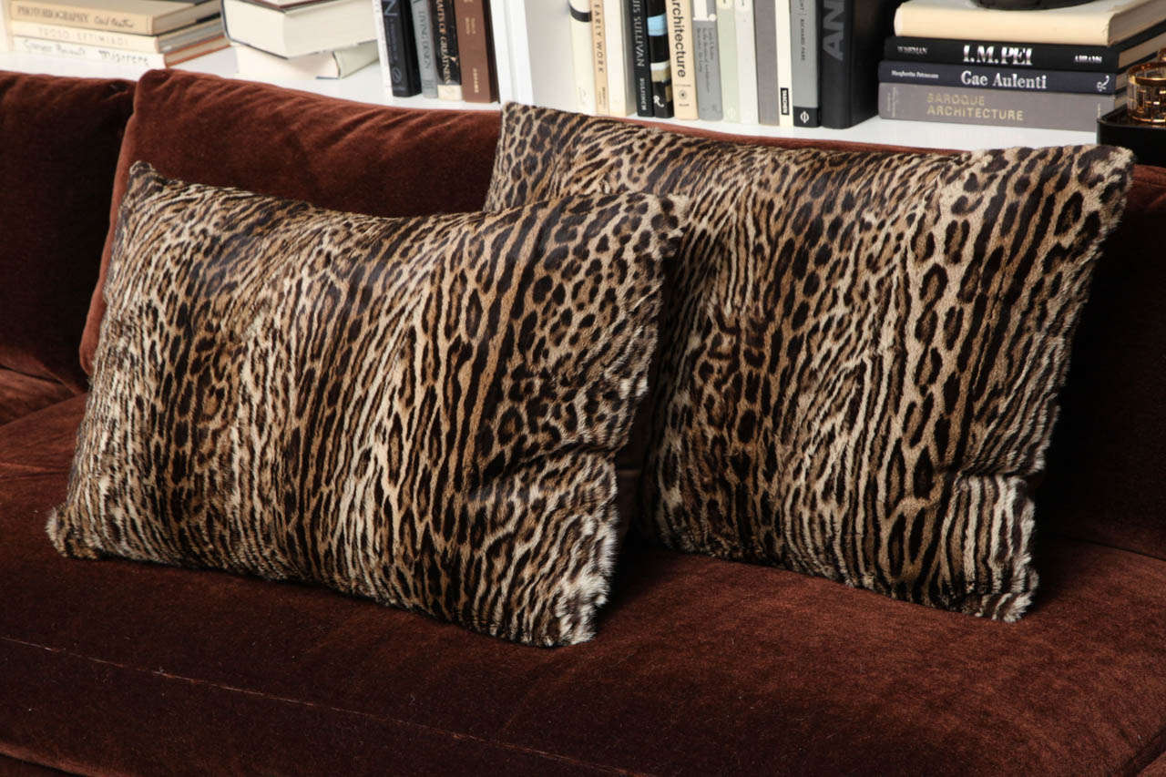 Fur pillows with velvet backs, down filled.