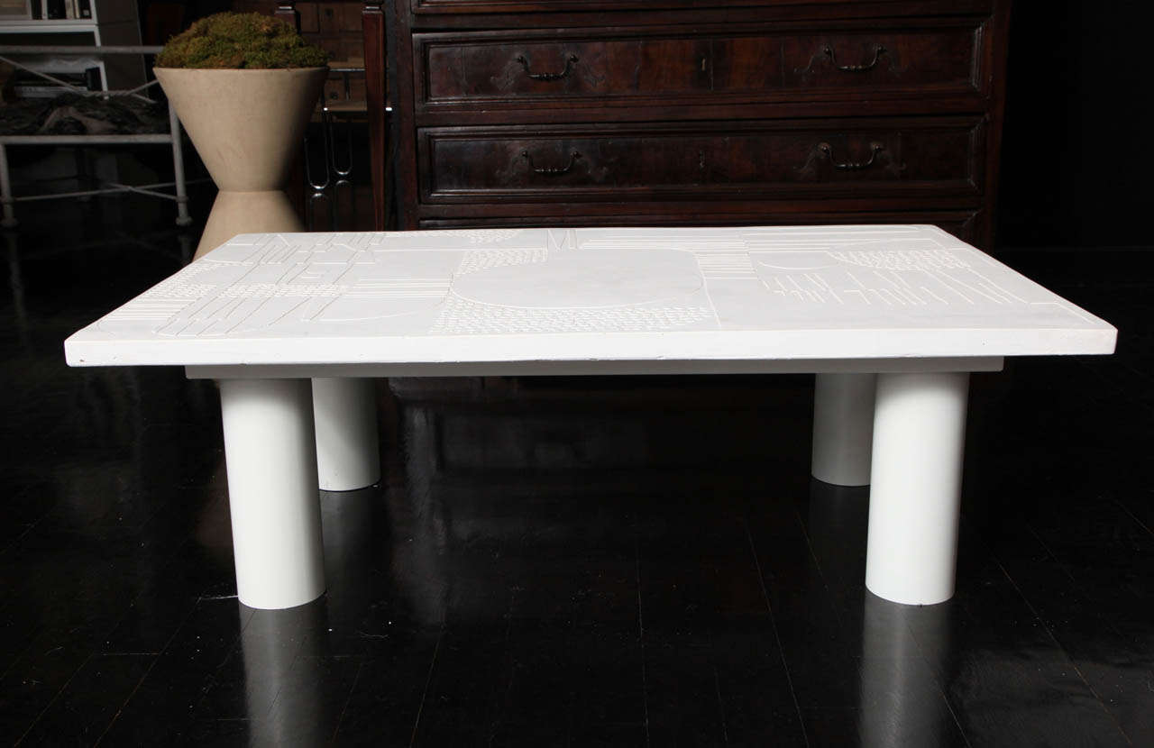 Abstract Modernist Plaster coffee table in waxed white plaster with a powder coated metal base. The table is sealed making it impervious to stains.