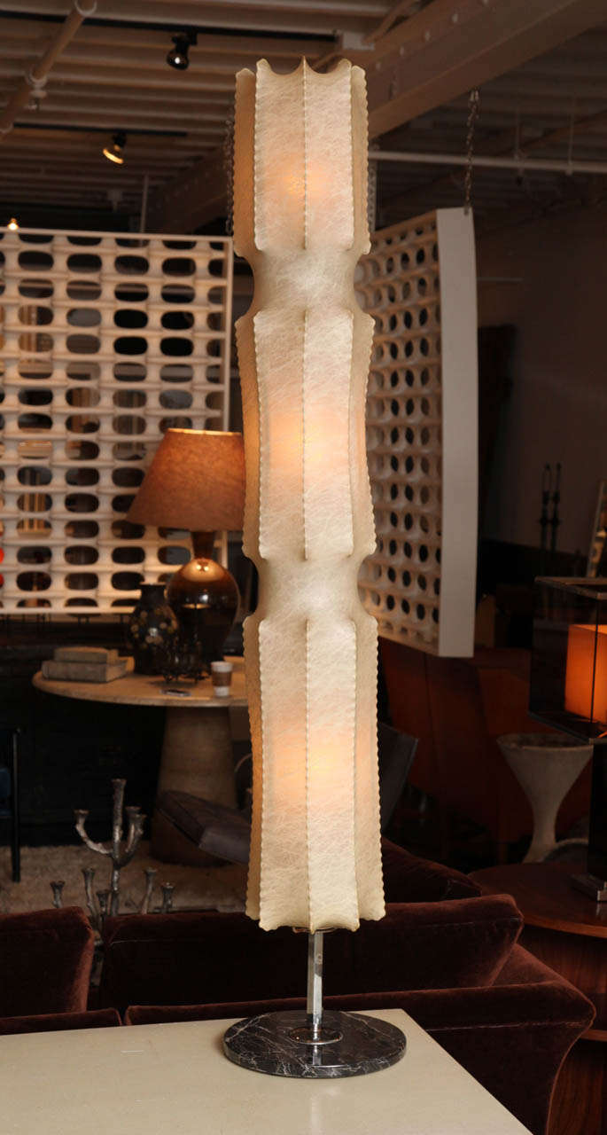 Italian modernist floor lamp with a goat skin shade in a cocoon shape on a base of variegated marble. The shade is in a remarkable state of preservation.