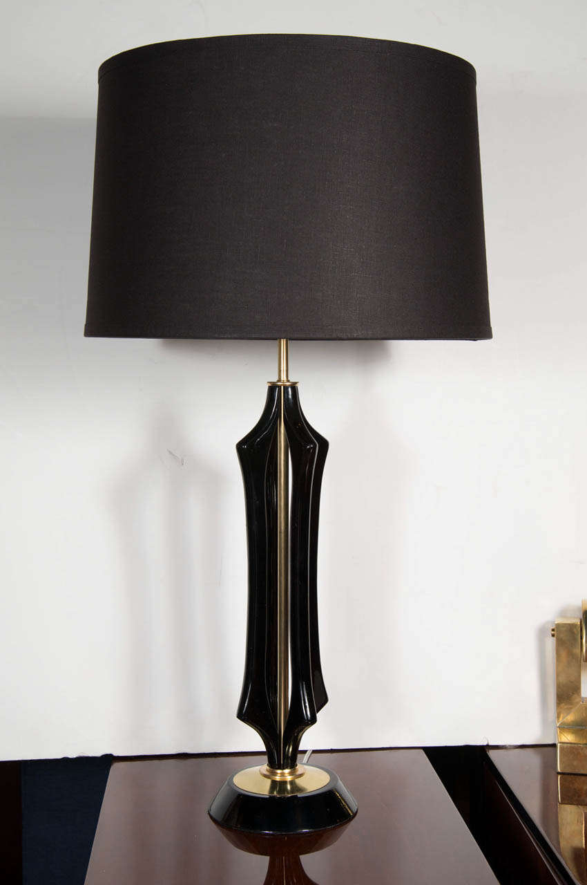 Chic Mid-Century Modernist table lamp featuring a sculptural geometric design in ebonized walnut with brass supports & fittings. Includes a new custom shade and has been newly rewired.