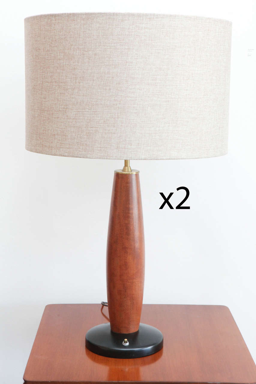 This Mid Century table lamp is the perfect accessory to any table top. Shade have been reupholstered for a beautiful sleek look.