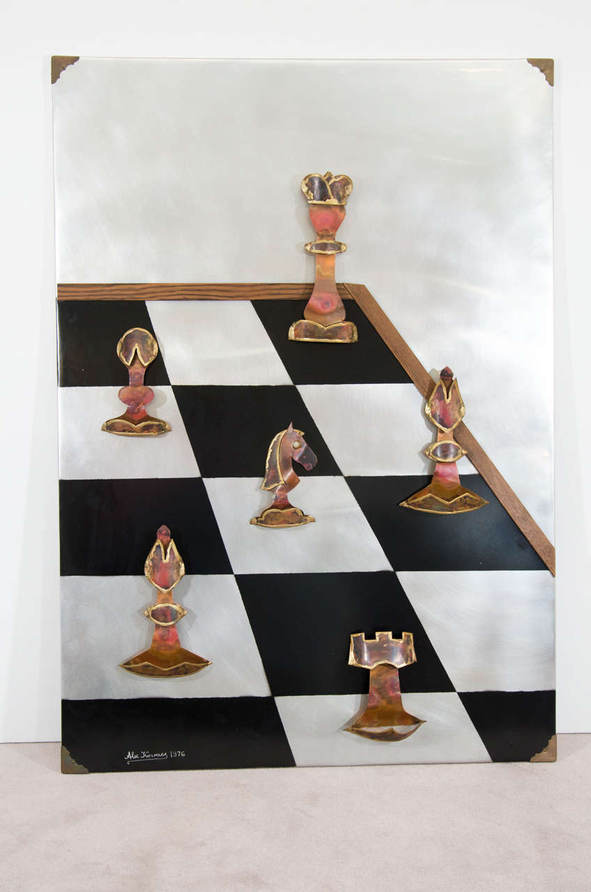 A signed metal and copper chess board game wall art piece by artist Alex Kovacs, circa 1970s, USA. Signed and dated 1976 as shown. The artist's original business card is attached on the back, as shown. Colors include, black, silver metal, gold, and