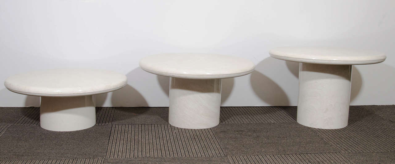 Trio of Italian White Swirled Cast Marble Modern Pedestal Form Tables of varying heights that can form various configurations, circa 1970s. 

Measures: Small 21